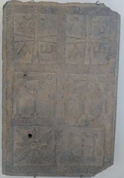 Interpret crosses with alpha and omega on a Christian grave owner, cross on a basalt tomb door, located in Bode Museum.